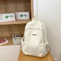 Casual minimalist white backpack for women, large capacity travel school bookbag. - White
