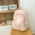 Casual pink school backpack for women, lightweight waterproof daypack with multiple pockets. - Pink