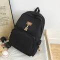 Minimalist black canvas student campus backpack, large capacity design for daily use. - Black