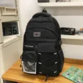 Black multi-functional school backpack with large capacity, mesh pockets, and front elastic cords. - Black