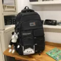 Large capacity black school backpack for students, multi-pocket casual daily daypack with cute pendants. - Black + Trendy Bear