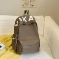 Casual large capacity student school backpack for women, minimalist design daily daypack. - Coffee