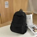 Casual canvas campus backpack for women and students, lightweight black travel daypack. - Black