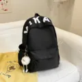 Casual black canvas backpack for school students with white letter print and cute pendant. - Black with Long Leg Ball