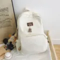 Casual canvas school backpack for students, large capacity daily daypack with cute bear pendant. - Dog Pendant Style / White