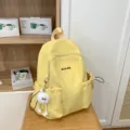 Lightweight casual canvas backpack for women and girls school travel daypack waterproof bookbag - Yellow with Long Leg Ball