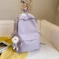 Japanese style minimalist large capacity purple canvas backpack with cute plush pendant for student. - Purple with Long Leg Ball