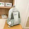 Lightweight green casual backpack large capacity school bag with cute plush pendant - Green with Long Leg Ball