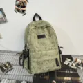 Vintage wash canvas casual backpack, large capacity school bag for students daily use. - Cord Pendants / Green