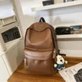 Brown PU leather backpack for women, stylish and waterproof daily school bag with laptop compart. - Pendant Style / Brown
