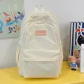Ins-style beige canvas backpack for students, lightweight casual school bag with cute fuzzy patch. - White
