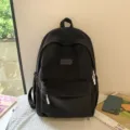 Black minimalist student backpack, casual style daily school bag with spacious compartments. - Black