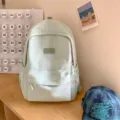 Minimalist solid color school backpack for high school students, casual daily daypack - Green