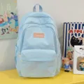 Light blue casual backpack for students, minimalist daily school bag with multiple pockets. - Blue