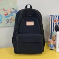 Casual black school backpack for teenage girls, lightweight daily daypack with patch. - Black