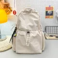 Solid color nylon backpack for women, large capacity lightweight school bag and travel daypack. - Off-White + Racket Pendant
