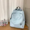 Casual light blue backpack for daily school travel, stylish student bookbag with pockets. - Blue