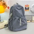 Grey nylon backpack for women, large capacity school bag for students, casual daily travel. - Gray + Racket Pendant