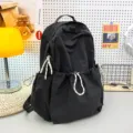 Solid color nylon backpack for women, large capacity student school bag, lightweight travel daypack. - Black + Racket Pendant
