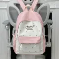 Cute pink and white polka dot student backpack with clear front pocket for daily school use. - Pink