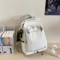White waterproof school backpack for travel and daily use, large capacity student bookbag. - White With Frog Pendant