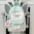 Light green and white polka dot school backpack with transparent pocket and cute plush pendant. - Bone and Puppy Face Pendant Style / Green