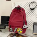 Large capacity trendy red backpack for students with cool patches and cute octopus pendant. - Red + Octopus