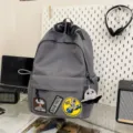 Casual grey canvas backpack with trendy patches and large capacity for daily school commute. - Gray + Octopus