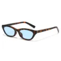 Schildpad cat-eye zonnebril met lichtblauwe lenzen, stijlvolle modieuze brillenvariant. - Schildpad Frame Blauwe Lenzen