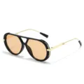 Oversized zonnebril met dubbele brug, dik zwart montuur en stijlvolle gouden pootjes. - Zwart Frame Licht Thee Lens