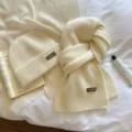 Detailed view of cozy white knitted beanie and scarf set, soft winter warm accessory. - Two-Piece Set / Off White / One Size