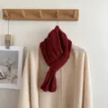 Cozy red cable knit cross scarf detail, showing soft texture and stylish neck warmer design. - Twist Cross Style / Burgundy