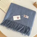 Cozy light blue 100% wool scarf featuring elegant fringe details and soft texture for winter. - Haze Blue
