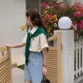 Women short sleeve shirt with green knit shawl and denim shorts outdoor detail shot - Grass Green