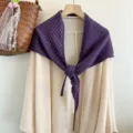 Detailed view of the purple hollow knitted triangular scarf, soft and stylish detail. - Purple