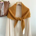Detailed view of cozy knit wool triangular scarf, warm autumn style corn stitch shawl. - Lemon Yellow