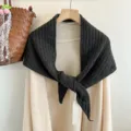 Detailed view of the dark grey wool knit triangle shawl, cozy texture and fine craftsmanship. - Dark Gray
