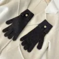 Detailed shot of dark grey knit gloves with button accent, perfect for autumn and winter wear. - One Size / Coffee