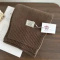 Brown 100% wool knitted scarf detail view, winter warm solid color neckwear fashion. - Coffee