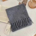 Cozy grey knitted wool winter scarf with stylish tassels and metal brand tag for cold weather. - Dark Gray / 170*22cm