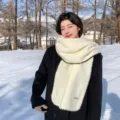 Cozy winter wool-blend scarf with chic black blanket stitch edge, warm and stylish. - White