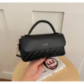 Black PU leather crossbody bag with woven texture accent, elegant top handle and flap closure. - Black