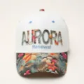 Detailed view of the white baseball cap with floral brim and embroidery text AURORA. - White