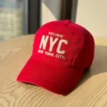Classic red cotton baseball cap with stylish NYC embroidery, soft top and comfortable fit. - Adult 54-60 Adjustable / Red