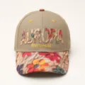 Close-up detail of stylish floral brim and embroidered letter logo on the casual cap. - Camel