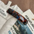 Tortoiseshell acetate hair clip detail shot, showing smooth texture and exquisite handmade finish. - Lake Blue Brown
