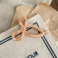 Elegant pink acetate hair claw clip with unique geometric loop design for daily stylish updos. - Colorful Orange