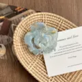 Detail view of the elegant blue flower hair claw clip, showing its unique marbled texture. - Floral Blue