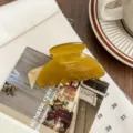 Amber acetate hair claw clip, detailed view of the elegant medium shark clip for women. - Yellow-Green