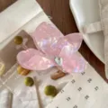 Close-up detail of pink mermaid acetate butterfly hair claw clip with sparkling rhinestone decor. - L / Colorful Purple